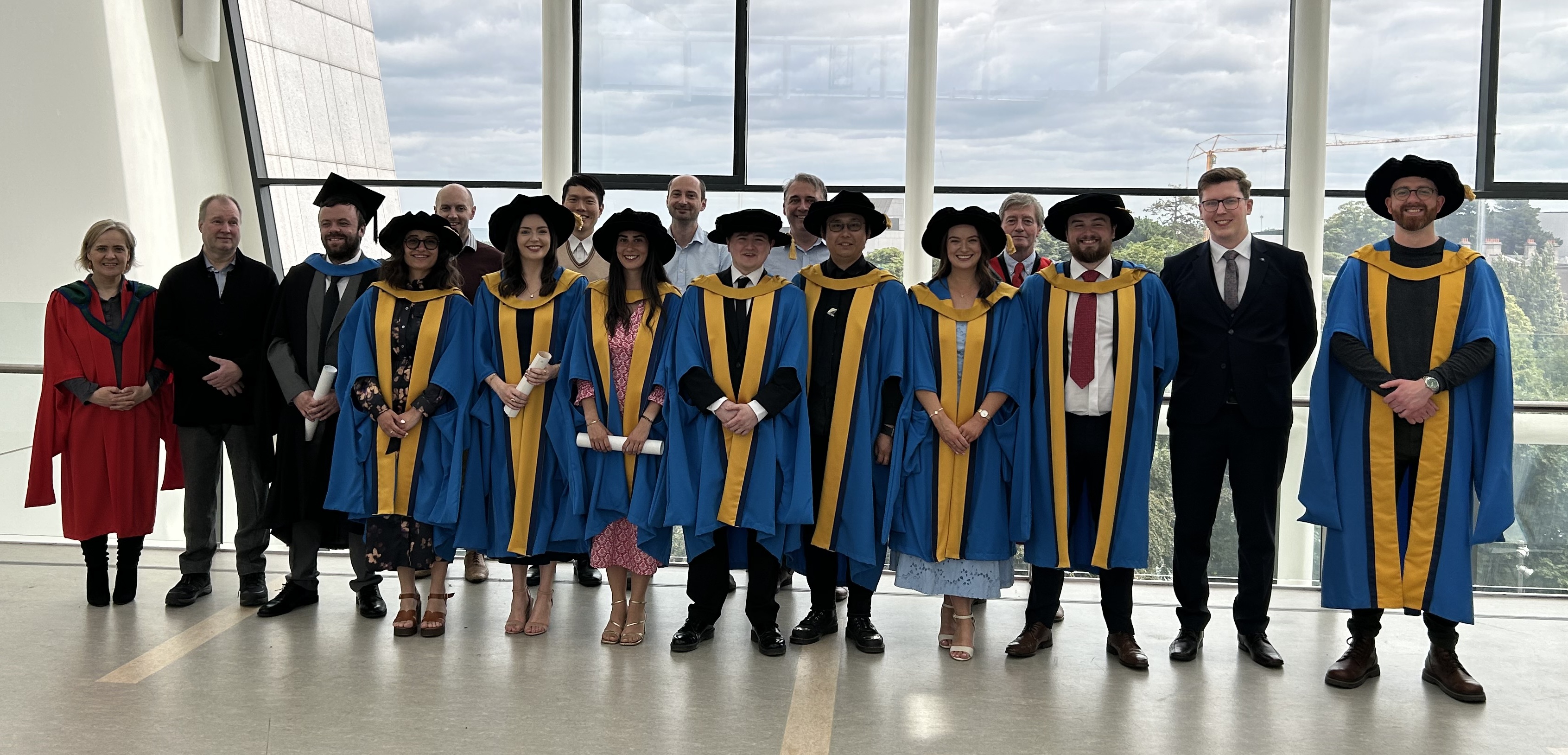 Group of students & staff at conferring